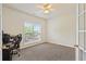 Office space bathed in natural light and features a ceiling fan and neutral decor at 209 Crestmont Way, Canton, GA 30114