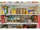 Well-organized pantry featuring shelving stocked with food items in jars, cans, and boxes at 209 Crestmont Way, Canton, GA 30114