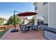 Relax on the patio with outdoor seating and a large umbrella for shade at 209 Crestmont Way, Canton, GA 30114