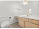 Well-lit bathroom featuring a large vanity and a separate toilet area at 2139 Briar Glen Sw Ln, Atlanta, GA 30331