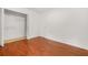Hardwood bedroom with an open closet and bright light at 2139 Briar Glen Sw Ln, Atlanta, GA 30331