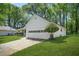 Side view of a well-maintained home, highlighting the attached two-car garage at 2139 Briar Glen Sw Ln, Atlanta, GA 30331