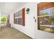 Inviting covered front porch with red shutters, creating a warm and welcoming entrance at 2139 Briar Glen Sw Ln, Atlanta, GA 30331