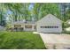Charming single-story home with a well-manicured lawn and attached two-car garage at 2139 Briar Glen Sw Ln, Atlanta, GA 30331