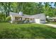 Quaint one-story home featuring a lush green lawn and an attached two-car garage at 2139 Briar Glen Sw Ln, Atlanta, GA 30331
