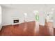 Bright living room featuring hardwood floors and a cozy fireplace at 2139 Briar Glen Sw Ln, Atlanta, GA 30331