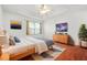 Tranquil bedroom showcasing tray ceilings and ample natural light from the window at 2139 Briar Glen Sw Ln, Atlanta, GA 30331
