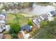 Beautiful aerial view of a blue home on a lake lot in a quiet neighborhood at 2155 Old Dallas Rd, Marietta, GA 30064