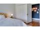 Bright bedroom with a white color scheme, a double door closet and hardwood flooring at 2155 Old Dallas Rd, Marietta, GA 30064