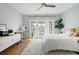 Spacious bedroom with natural light and decor, area rug, and ceiling fan at 2155 Old Dallas Rd, Marietta, GA 30064