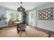 Dining room features a modern light fixture, area rug, and neutral color palette at 2155 Old Dallas Rd, Marietta, GA 30064
