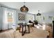 Open floor plan dining room area with statement lighting and large windows at 2155 Old Dallas Rd, Marietta, GA 30064