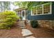 A charming home with stone steps leading up to a screened-in porch at 2155 Old Dallas Rd, Marietta, GA 30064