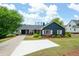 Inviting home with mature trees, landscaped lawn, and convenient covered parking at 2155 Old Dallas Rd, Marietta, GA 30064