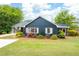 Beautiful blue home with well-maintained landscaping and a cozy screened-in porch at 2155 Old Dallas Rd, Marietta, GA 30064