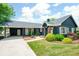 Well-maintained home with lush landscaping, a covered carport, and a welcoming front entrance at 2155 Old Dallas Rd, Marietta, GA 30064