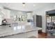Modern kitchen features white cabinets, stainless steel appliances, and marble countertops at 2155 Old Dallas Rd, Marietta, GA 30064