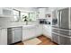 Bright, modern kitchen with stainless steel appliances and white cabinets at 2155 Old Dallas Rd, Marietta, GA 30064