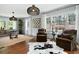 Stylish living room featuring hardwood floors, modern lighting, and large windows with backyard views at 2155 Old Dallas Rd, Marietta, GA 30064