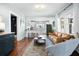 Bright living room featuring hardwood floors, an open floor plan, and large windows at 2155 Old Dallas Rd, Marietta, GA 30064