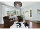Bright living room featuring hardwood floors, modern lighting, and large windows with natural light at 2155 Old Dallas Rd, Marietta, GA 30064