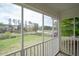 Enjoy picturesque backyard views in this screened porch overlooking the green lawn and lake at 2155 Old Dallas Rd, Marietta, GA 30064