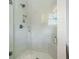 Modern shower with glass doors, white tile and a niche for soaps and shampoos at 2155 Old Dallas Rd, Marietta, GA 30064