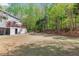 Large, lush backyard with ample space for outdoor activities and entertaining, offering privacy and serenity at 335 Birkdale Dr, Fayetteville, GA 30215