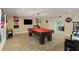 Finished basement area with a pool table, bar, and decorative sports memorabilia at 335 Birkdale Dr, Fayetteville, GA 30215