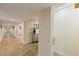 Basement hallway is well-lit and spacious, with tile flooring, connecting various rooms and amenities at 335 Birkdale Dr, Fayetteville, GA 30215
