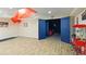 Basement area leads to an in-home movie theatre, complete with a popcorn machine and themed decor at 335 Birkdale Dr, Fayetteville, GA 30215