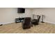 Finished basement area with tile floors, a mounted TV, and lounge seating at 335 Birkdale Dr, Fayetteville, GA 30215