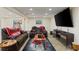 Basement living room space with a large screen TV and comfortable seating, perfect for relaxation at 335 Birkdale Dr, Fayetteville, GA 30215