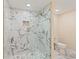 Bathroom features a modern shower with marble tiles and a glass door for a spa-like experience at 335 Birkdale Dr, Fayetteville, GA 30215