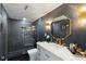 Modern bathroom with walk-in shower, gold fixtures, and stylish accent wall at 335 Birkdale Dr, Fayetteville, GA 30215