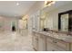 Large primary bathroom with a step-up soaking tub, dual vanity, and marble floors at 335 Birkdale Dr, Fayetteville, GA 30215