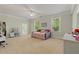 Bright bedroom with neutral walls, large windows, and a cozy daybed for relaxing or entertaining at 335 Birkdale Dr, Fayetteville, GA 30215