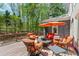 Outdoor deck seating area with umbrella table, perfect for entertaining Gathering and friends at 335 Birkdale Dr, Fayetteville, GA 30215