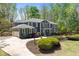 Elegant two-story home with a wide driveway, lush landscaping, and well-maintained lawn at 335 Birkdale Dr, Fayetteville, GA 30215