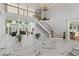 Expansive foyer featuring marble floors, a staircase, and views into the living area at 335 Birkdale Dr, Fayetteville, GA 30215