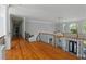 Bright hallway with hardwood floors, elegant railings, and high ceilings at 335 Birkdale Dr, Fayetteville, GA 30215