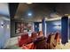 Home theater features comfortable seating, a projector, and a large screen for the perfect movie night at 335 Birkdale Dr, Fayetteville, GA 30215