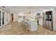 Updated kitchen features a center island, stainless steel appliances and ample countertop space at 335 Birkdale Dr, Fayetteville, GA 30215