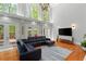 Bright living room with high ceilings, large windows, and a spacious layout for relaxation and entertaining at 335 Birkdale Dr, Fayetteville, GA 30215