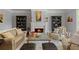 Elegant living room showcasing fireplace, decorative shelving, and a plush seating arrangement at 335 Birkdale Dr, Fayetteville, GA 30215