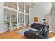 Spacious living room featuring hardwood floors, a modern chandelier, and an open-concept design at 335 Birkdale Dr, Fayetteville, GA 30215