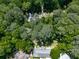 Aerial view of the property nestled among mature trees and other beautiful landscaping at 4307 Smithsonia Ct, Tucker, GA 30084