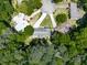Stunning aerial view of a home nestled among mature trees and lush landscaping in a desirable neighborhood at 4307 Smithsonia Ct, Tucker, GA 30084