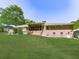 Spacious brick home backyard featuring screened in porch, deck, and lush lawn at 4307 Smithsonia Ct, Tucker, GA 30084