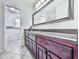 Bathroom featuring vanity with granite counters and purple wood drawers and cabinets at 4307 Smithsonia Ct, Tucker, GA 30084